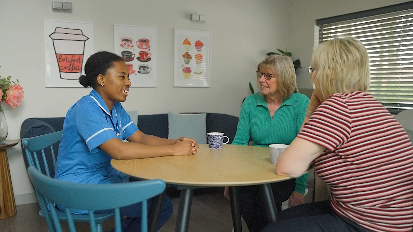 Ethical storytelling at St Michael’s Hospice, three women sit around a table